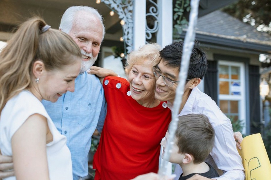 adult child hugging elderly parent