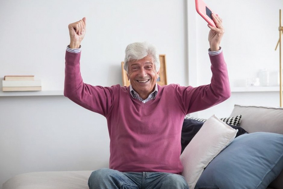 elderly person using smartphone caution
