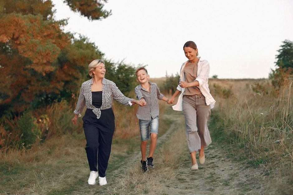 two generations walking together outdoors