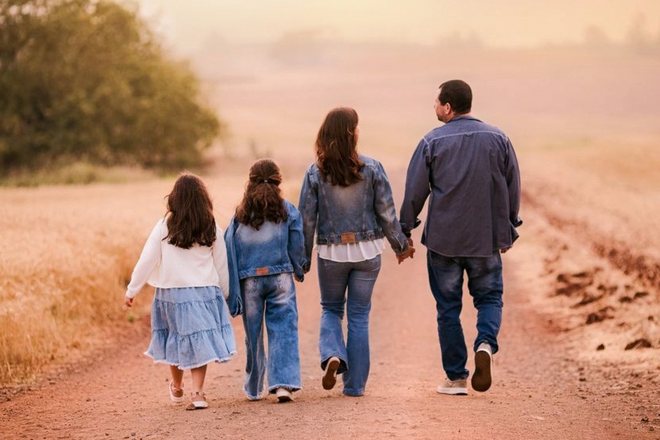 family walking together sunset