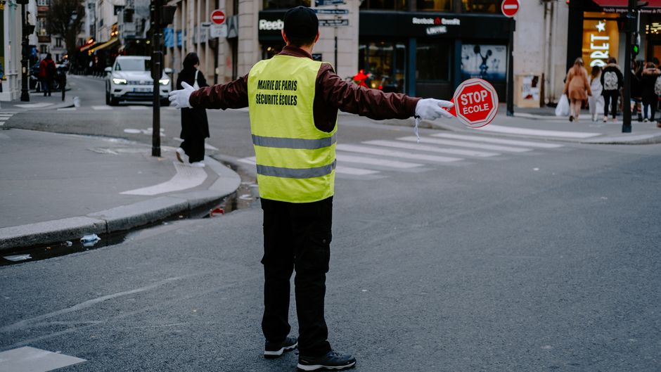 elderly volunteer school crossing guard
