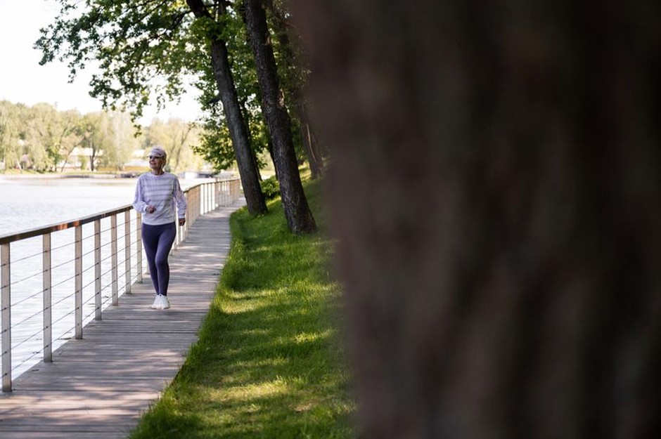 person walking morning exercise park