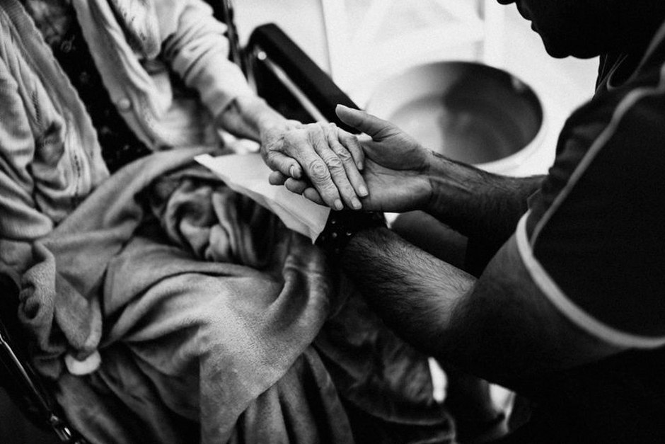 home care worker helping elderly patient