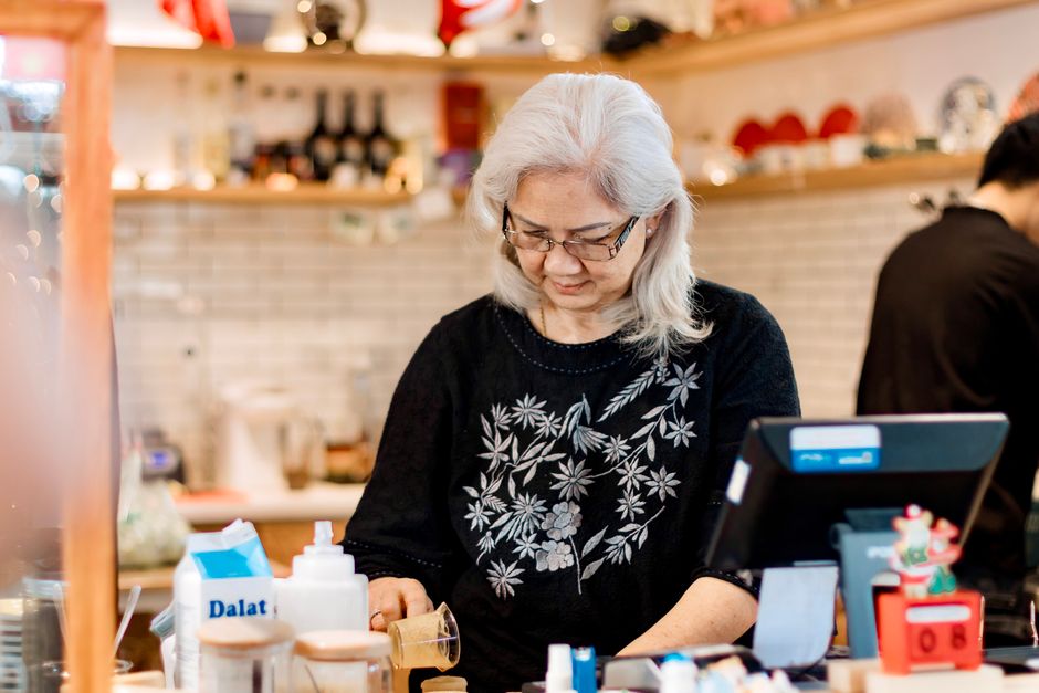 senior woman working cafe barista