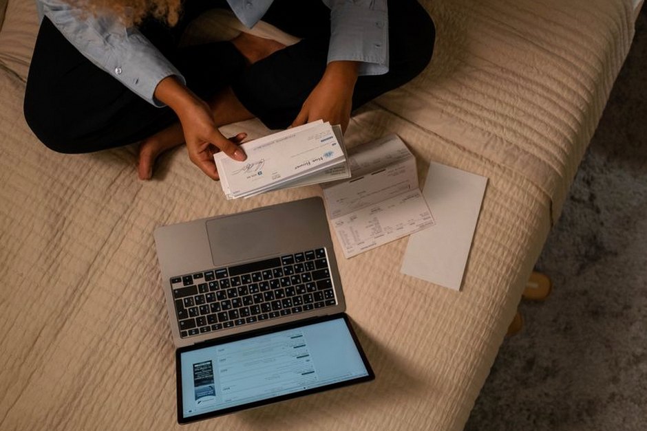 person checking finances laptop home