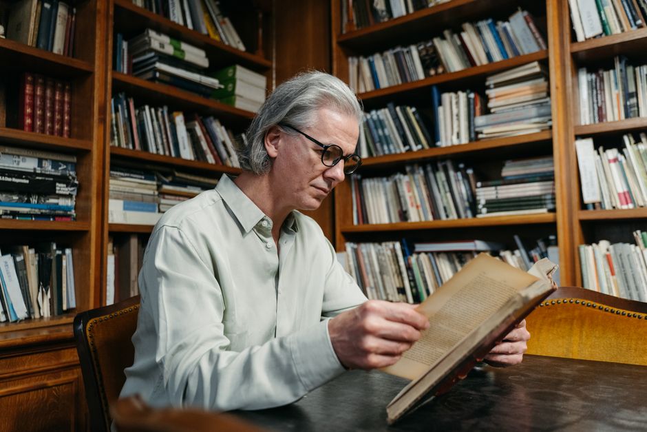 senior citizen reading book library