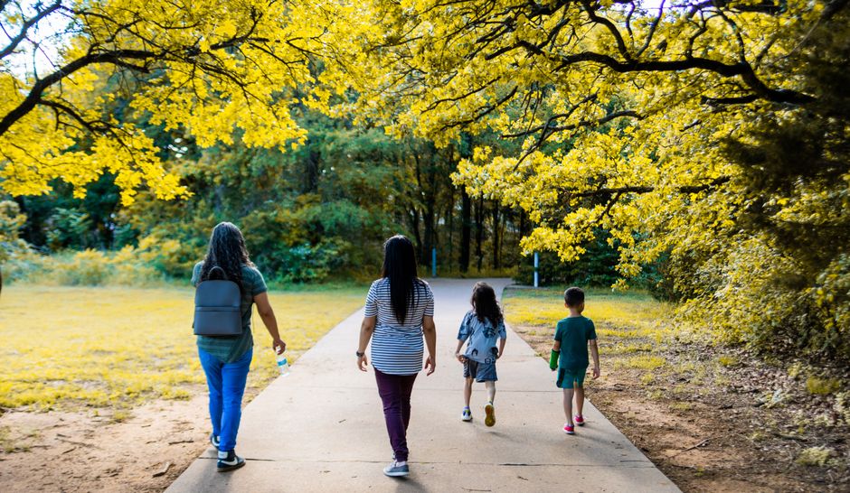 family walking in park seasonal health
