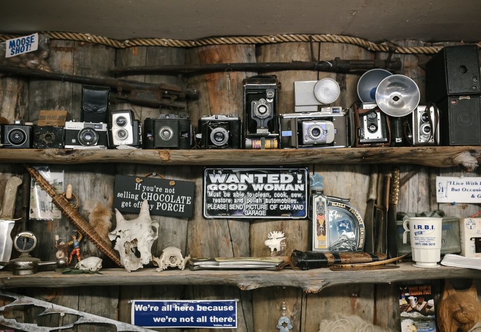 collector organizing vintage items shelf