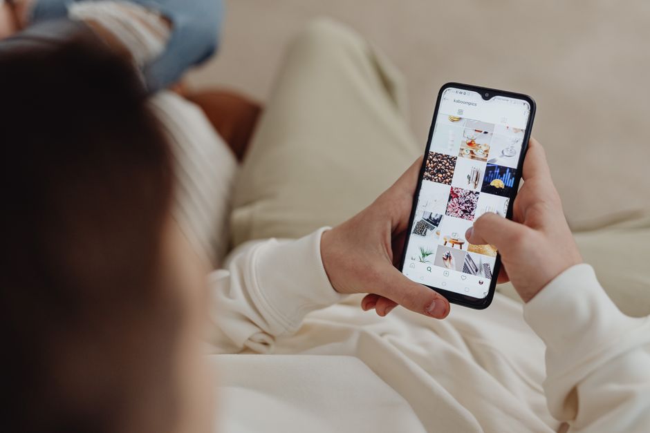 overwhelmed person scrolling smartphone photo gallery