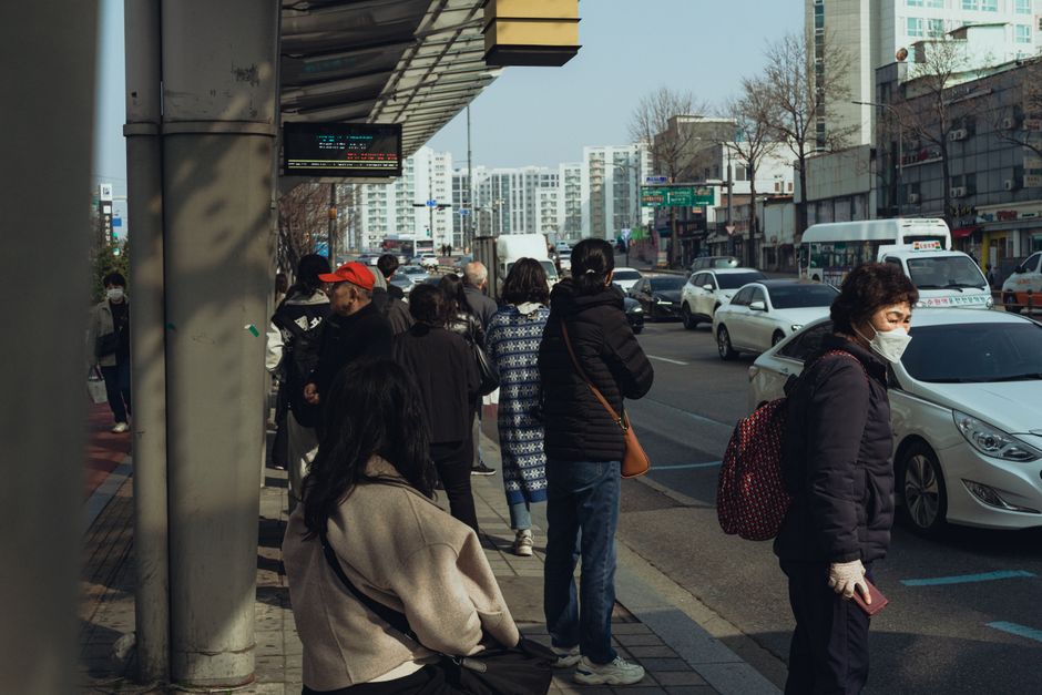 korean city bus stop commuters