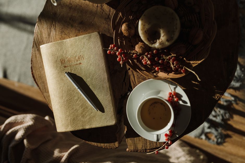 cozy notebook coffee cup morning light