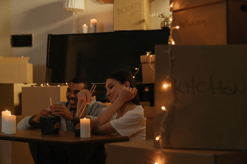 couple having candlelit dinner at home