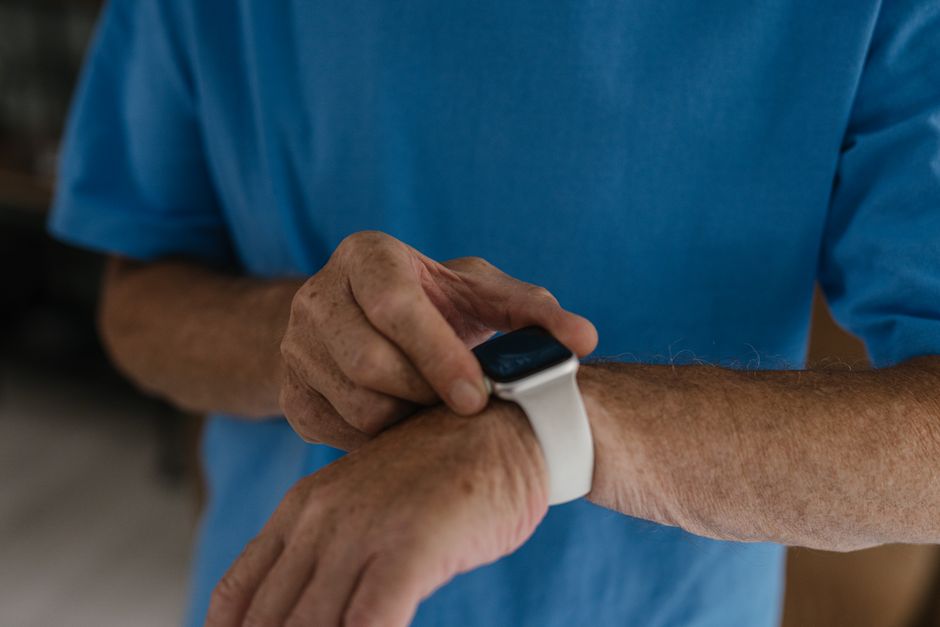 senior man using smart watch health tracker