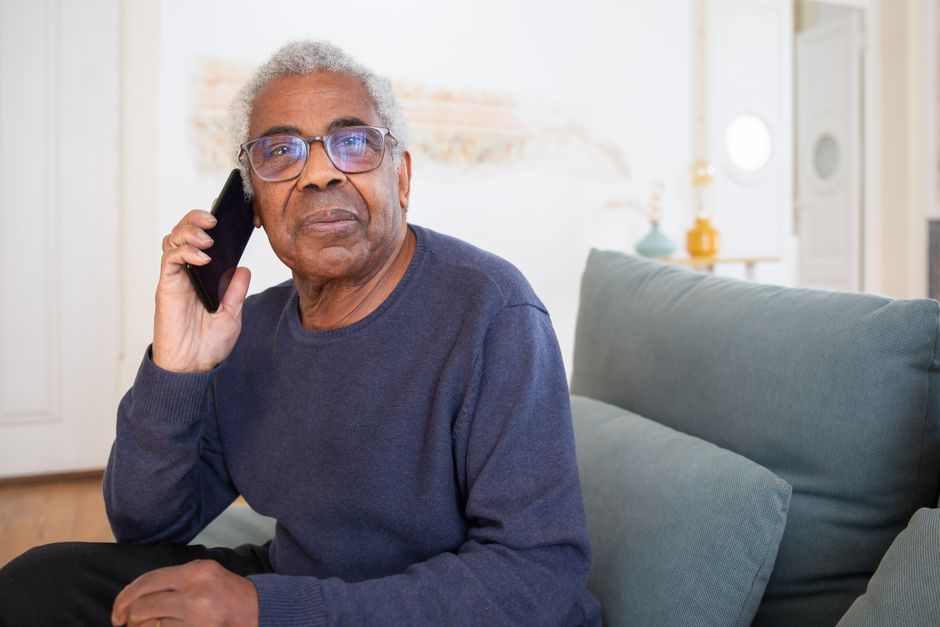 senior citizen using emergency call button