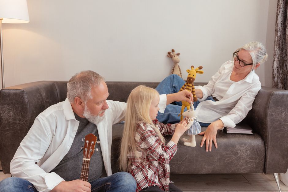 grandparents playing with grandchild