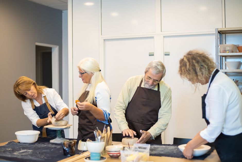 senior person learning new hobby class