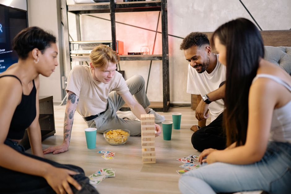friends board game night home living room