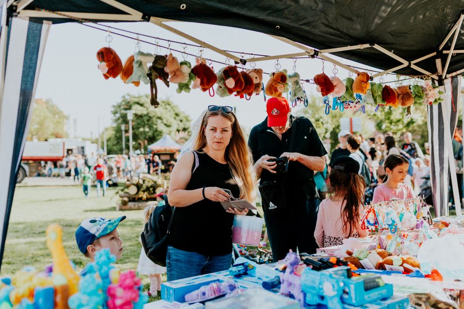 family enjoying local festival food stalls