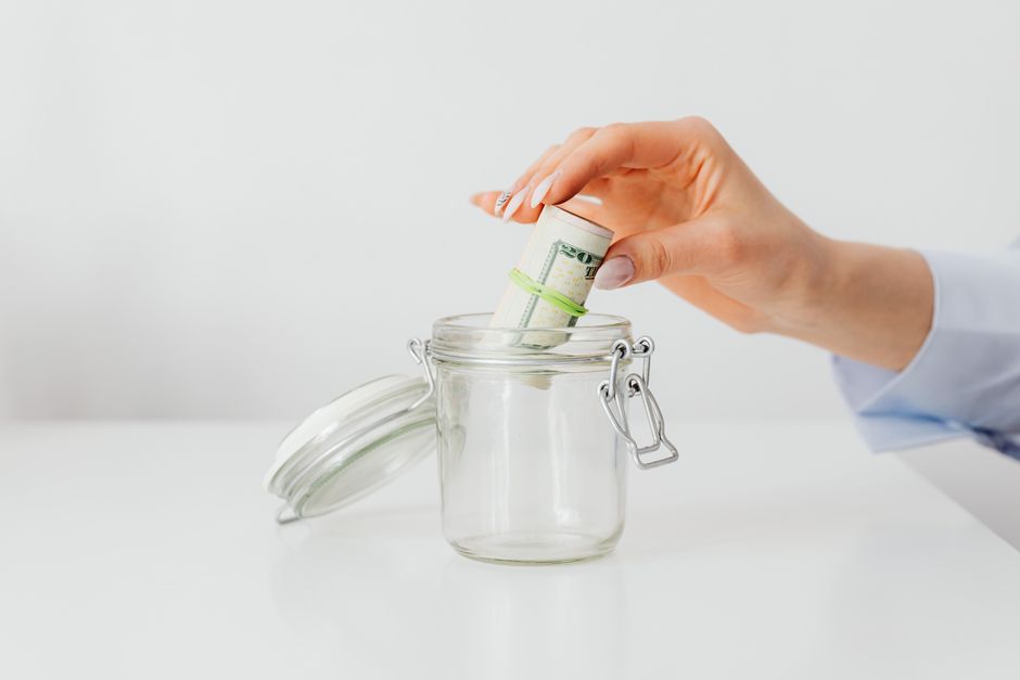 person saving money jar simple happy