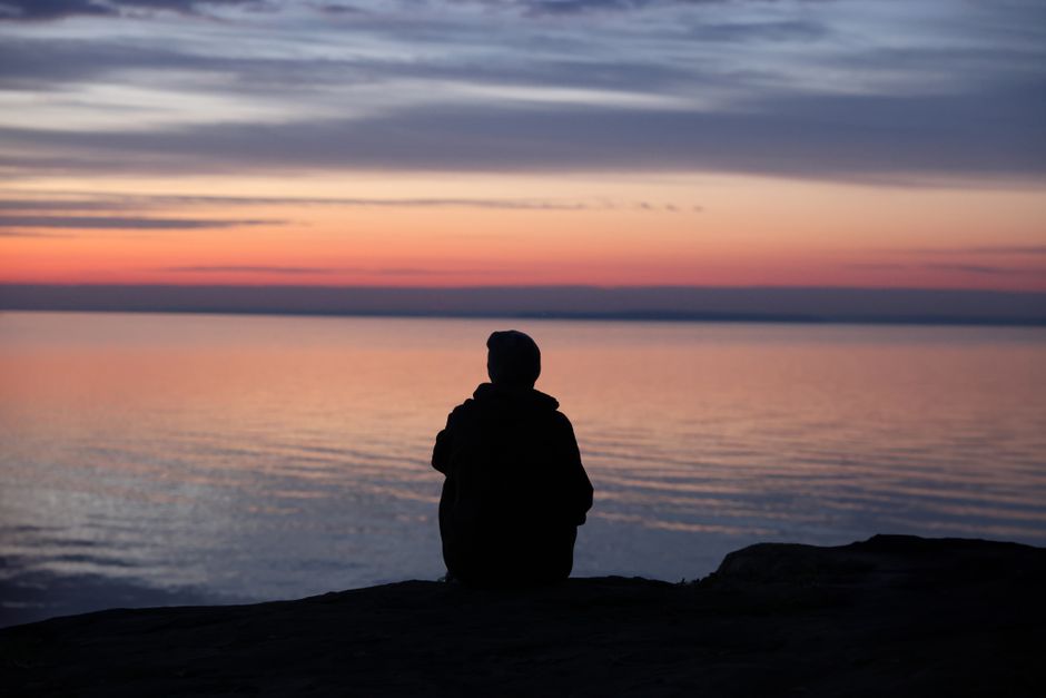 person meditating calm evening