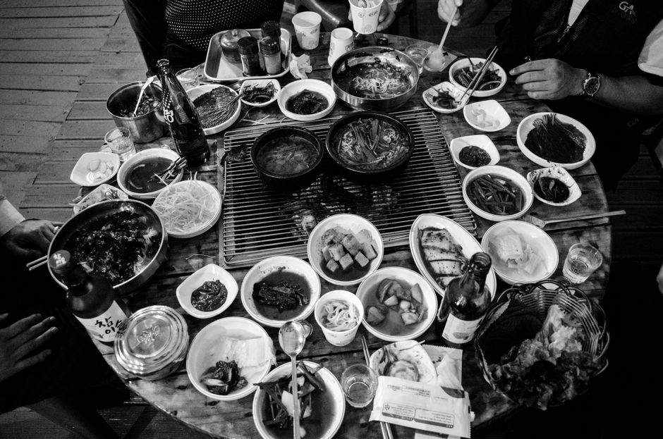 korean neighbors sharing meal together outdoor