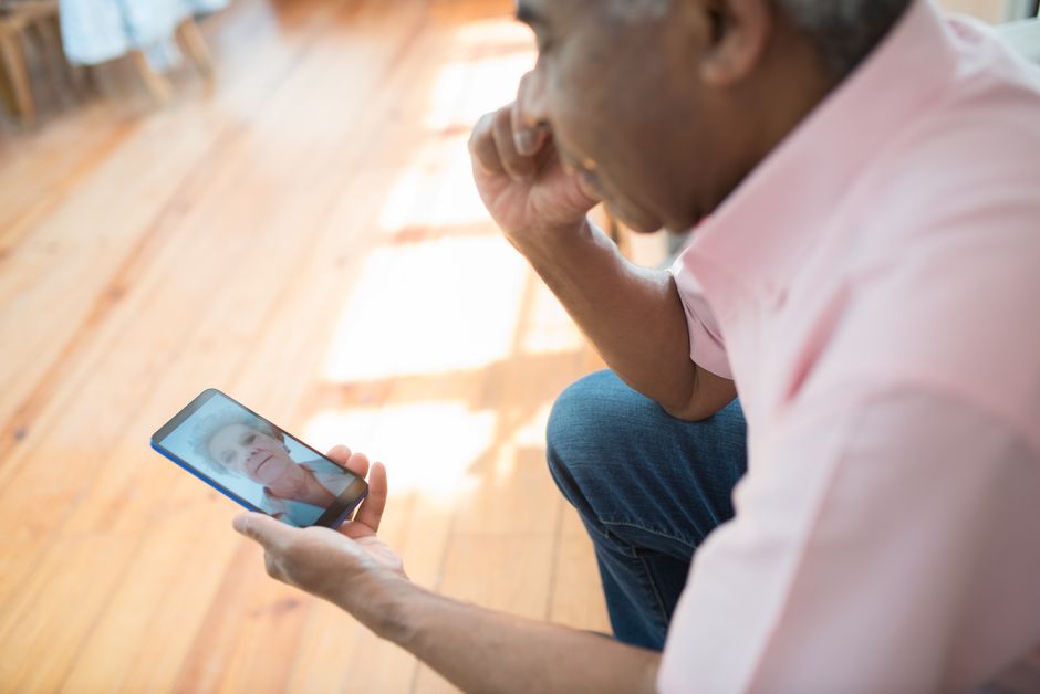 senior using smartphone video call family