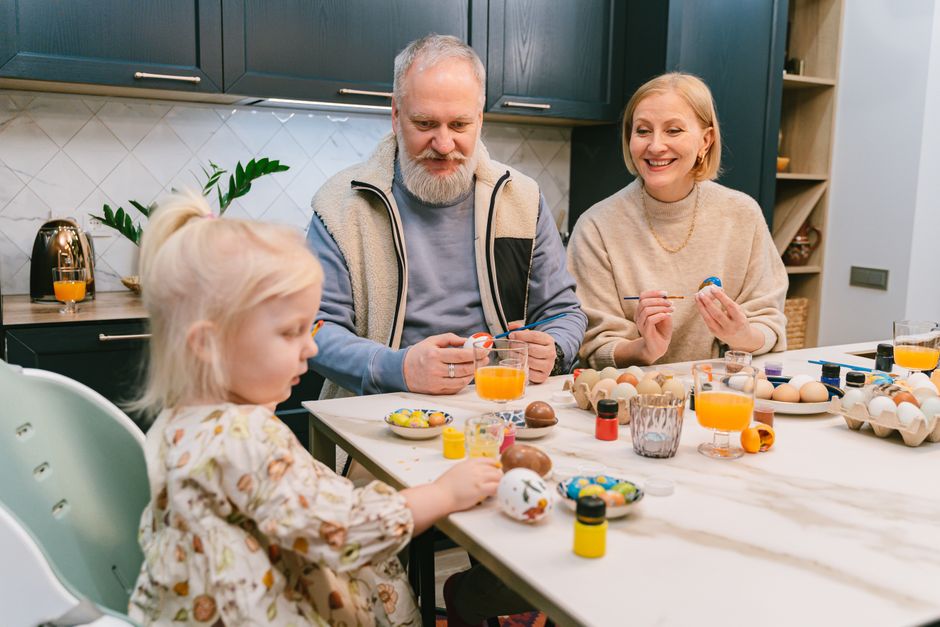 elderly couple making crafts together at table