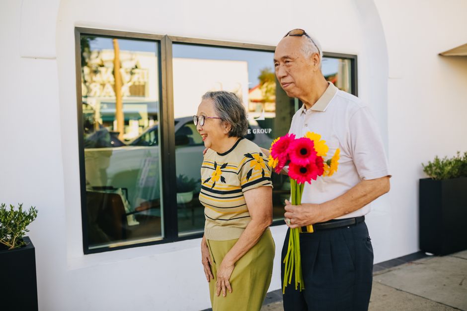 happy korean senior couple outdoor walking